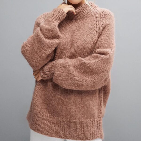 Lady wearing pink knitted high neck jumper